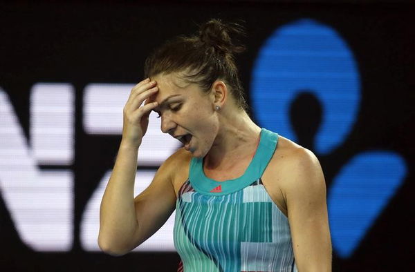 Romania&#8217;s Halep reacts after losing a point during her first round match against China&#8217;s Zhang at the Australian Open tennis tournament at Melbourne Park, Australia