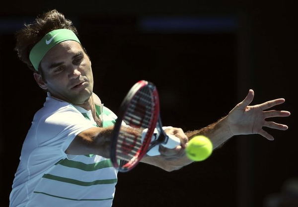 Switzerland&#8217;s Federer hits a shot during his second round match against Ukraine&#8217;s Dolgopolov at the Australian Open tennis tournament at Melbourne Park, Australia