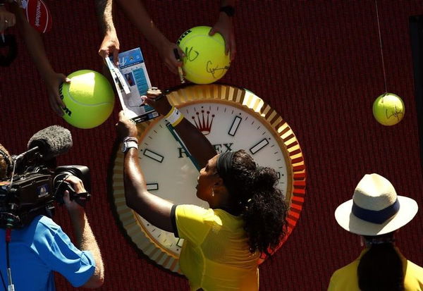 Williams of the U.S. signs autographs after winning her second round match against Taiwan&#8217;s Hsieh at the Australian Open tennis tournament at Melbourne Park, Australia