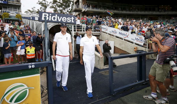 England&#8217;s captain Alastair Cook arrives for a briefing with teammate Stuart Broad at the end of the third cricket test match against South Africa in Johannesburg