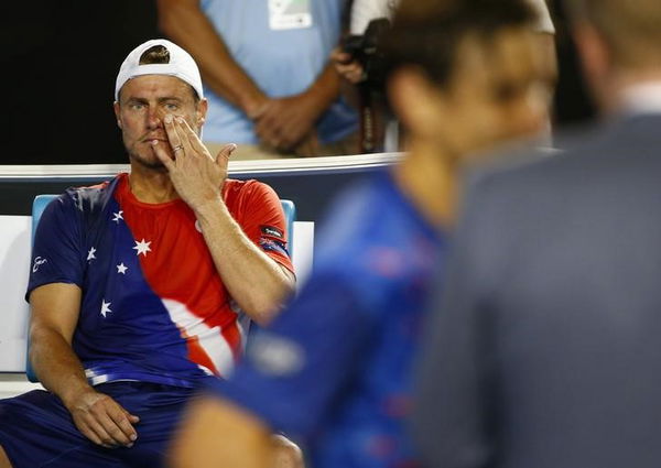 Australia&#8217;s Hewitt sits in his chair as Spain&#8217;s Ferrer is interviewed after Ferrer won their second round match at the Australian Open tennis tournament at Melbourne Park