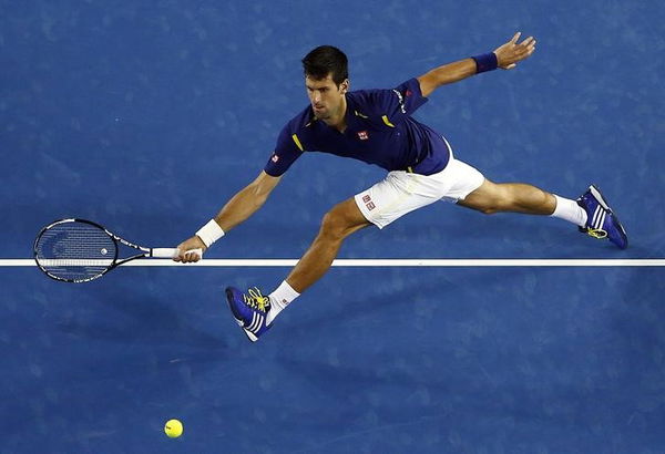 Serbia&#8217;s Djokovic stretches to hit a shot during his second round match against France&#8217;s Halys at the Australian Open tennis tournament at Melbourne Park