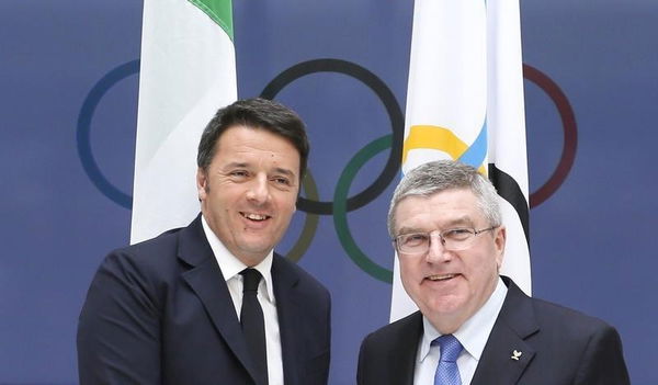 Italian Prime Minister Renzi and International Olympic Committee President Bach pose after meeting at the IOC headquarters in Lausanne