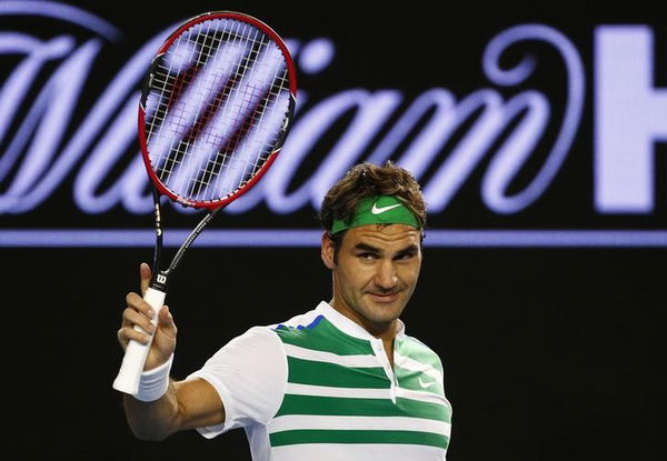 Switzerland&#8217;s Federer reacts after winning his third round match against Bulgaria&#8217;s Dimitrov at the Australian Open tennis tournament at Melbourne Park