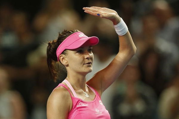 Poland&#8217;s Radwanska waves after winning her fourth round match against Germany&#8217;s Friedsam at the Australian Open tennis tournament at Melbourne Park