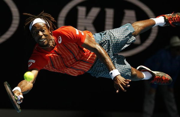 France&#8217;s Monfils dives for a shot during his fourth round match against Russia&#8217;s Kuznetsov at the Australian Open tennis tournament at Melbourne Park