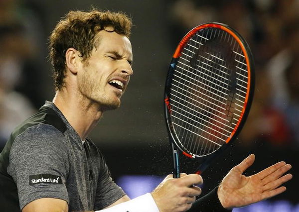 Britain&#8217;s Murray reacts during his fourth round match against Australia&#8217;s Tomic at the Australian Open tennis tournament at Melbourne Park