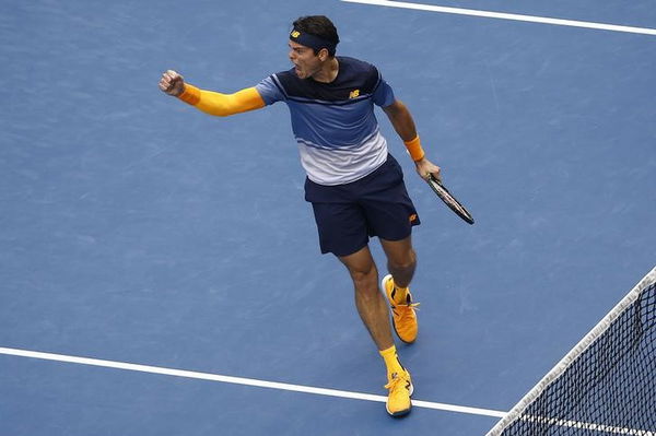 Canada&#8217;s Raonic reacts after winning his fourth round match against Switzerland&#8217;s Wawrinka at the Australian Open tennis tournament at Melbourne Park