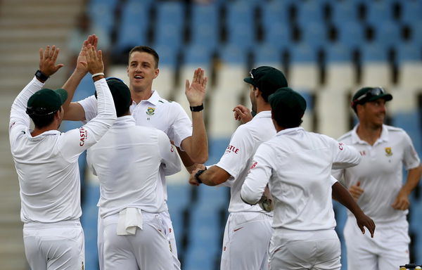 South Africa&#8217;s Morne Morkel is congratulated by team mates after he bowled out England&#8217;s captain Alastair Cook during the fourth cricket test match at Centurion, South Africa