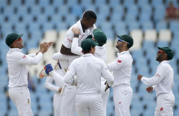 South Africa&#8217;s Rabada celebrates with his teammates the dismissal of England&#8217;s Bairstow after he was caught out by wicket keeper de Kock during the fourth cricket test match at Centurion