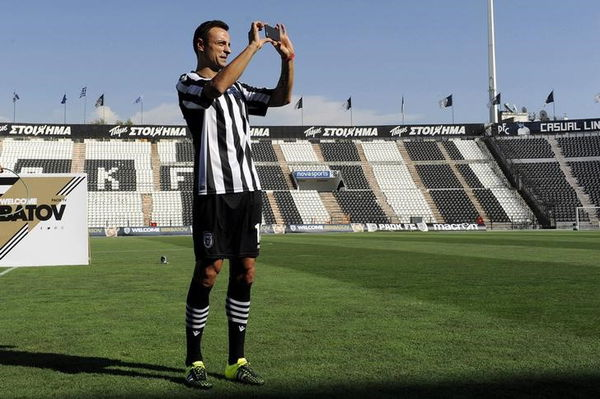 New PAOK Salonika&#8217;s soccer player Berbatov takes a picture with his mobile phone during his presentation at the Toumba stadium in Thessaloniki