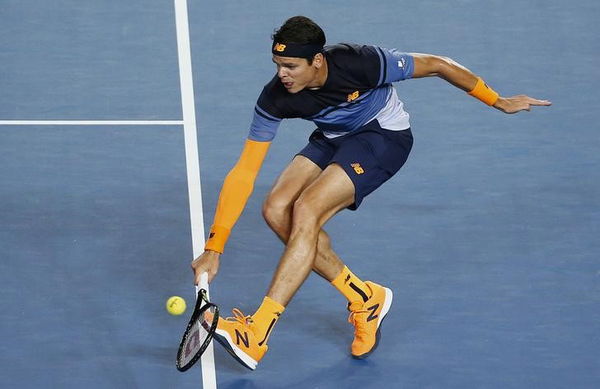 Canada&#8217;s Raonic hits a shot during his quarter-final match against France&#8217;s Monfils at the Australian Open tennis tournament at Melbourne Park