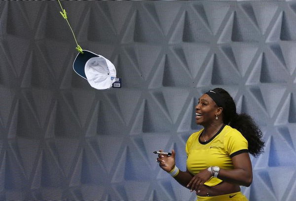 Williams of the U.S. reacts as she signs autographs after winning her semi-final match against Poland&#8217;s Radwanska at the Australian Open tennis tournament at Melbourne Park