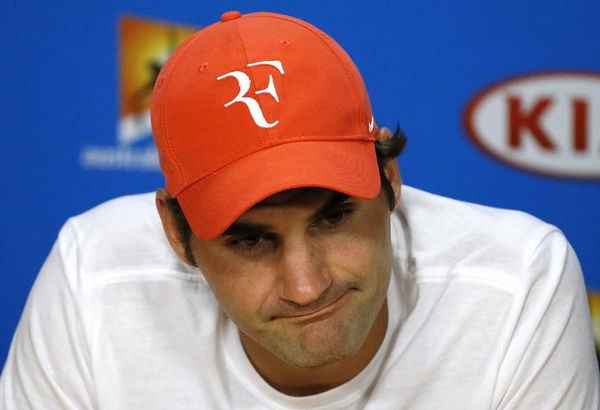 Switzerland&#8217;s Federer reacts during a news conference after losing his semi-final match against Serbia&#8217;s Djokovic at the Australian Open tennis tournament at Melbourne Park