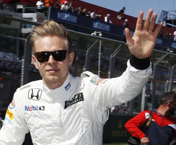 McLaren Formula One driver Kevin Magnussen of Denmark waves during the drivers parade before the Australian F1 Grand Prix at the Albert Park circuit in Melbourne