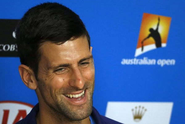 Serbia&#8217;s Novak Djokovic reacts during a news conference on the eve of his final match against Britain&#8217;s Andy Murray, at the Australian Open tennis tournament at Melbourne Park