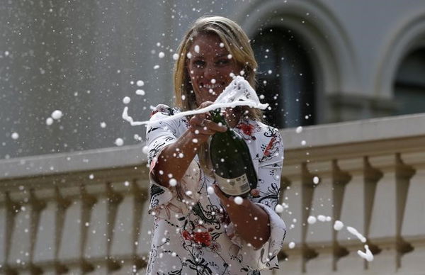 Germany&#8217;s Kerber sprays champagne a day after winning her final match at the Australian Open tennis tournament, at the Government House in Melbourne