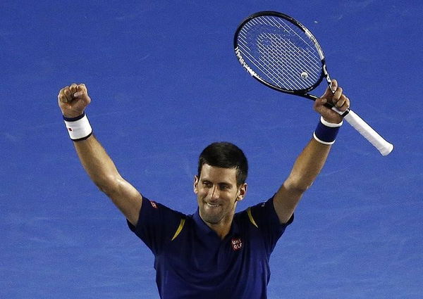 Serbia&#8217;s Djokovic celebrates after winning his semi-final match against Switzerland&#8217;s Federer at the Australian Open tennis tournament at Melbourne Park