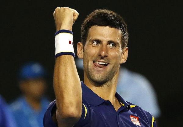 Serbia&#8217;s Djokovic celebrates after winning his semi-final match against Switzerland&#8217;s Federer at the Australian Open tennis tournament at Melbourne Park