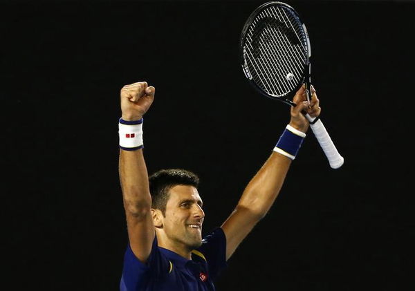 Serbia&#8217;s Djokovic celebrates after winning his semi-final match against Switzerland&#8217;s Federer at the Australian Open tennis tournament at Melbourne Park