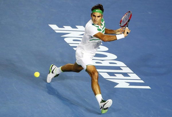 Switzerland&#8217;s Federer stretches for a ball during his fourth round match against Belgium&#8217;s Goffin at the Australian Open tennis tournament at Melbourne Park