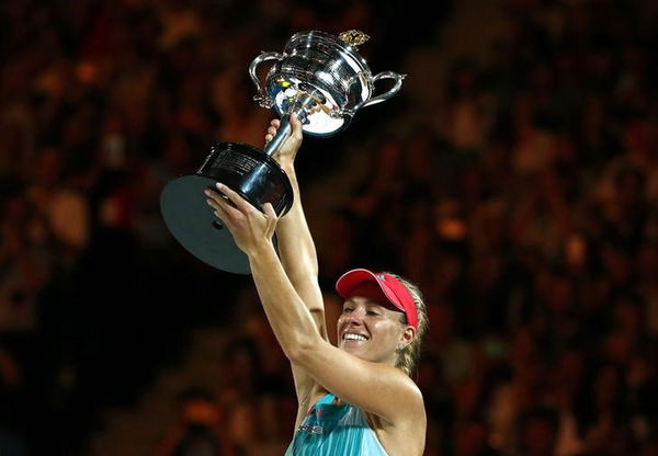 Germany&#8217;s Kerber celebrates with the trophy after winning her final match against Williams of the U.S. at the Australian Open tennis tournament at Melbourne Park