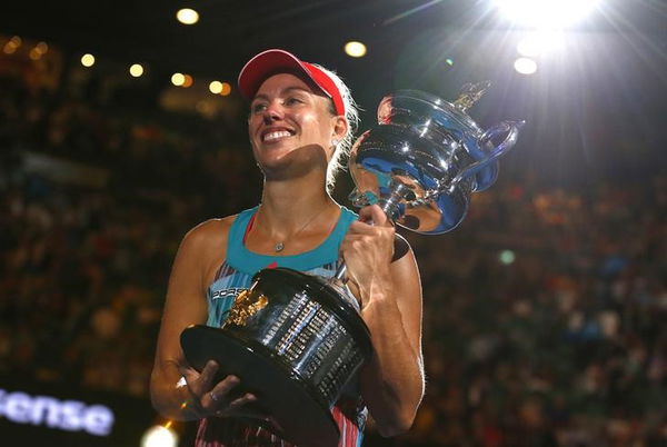 Germany&#8217;s Kerber celebrates with the trophy after winning her final match against Williams of the U.S. at the Australian Open tennis tournament at Melbourne Park