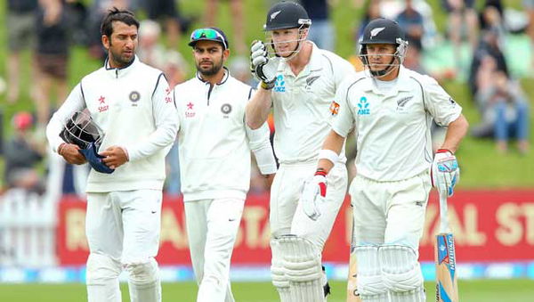 James-Neesham-and-Neil-Wagner-of-New-Zealand-leave-the-field-at-the-end-of-the-2nd-in