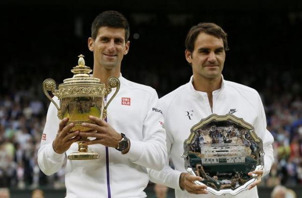 Winner, Novak Djokovic of Serbia and runner up Roger Federer of Switzerland pose with their trophies after their Men&#8217;s Singles Final match at the Wimbledon Tennis Championships in London