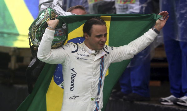 Felipe Massa carrying his country&#8217;s flag