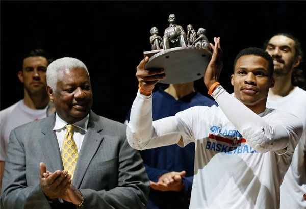 Oklahoma-City-Thunder-guard-Russell-Westbrook-is-applauded-by-Oscar-Robertson-on-his-triple-double-record