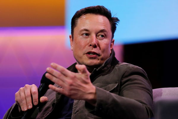 SpaceX owner and Tesla CEO Elon Musk gestures during a conversation with legendary game designer Todd Howard at the E3 gaming convention in Los Angeles