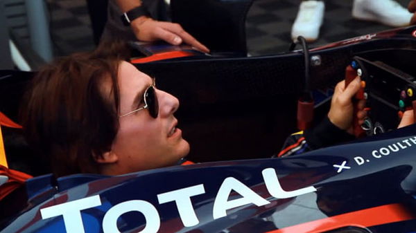 tom cruise in a Red Bull f1 car