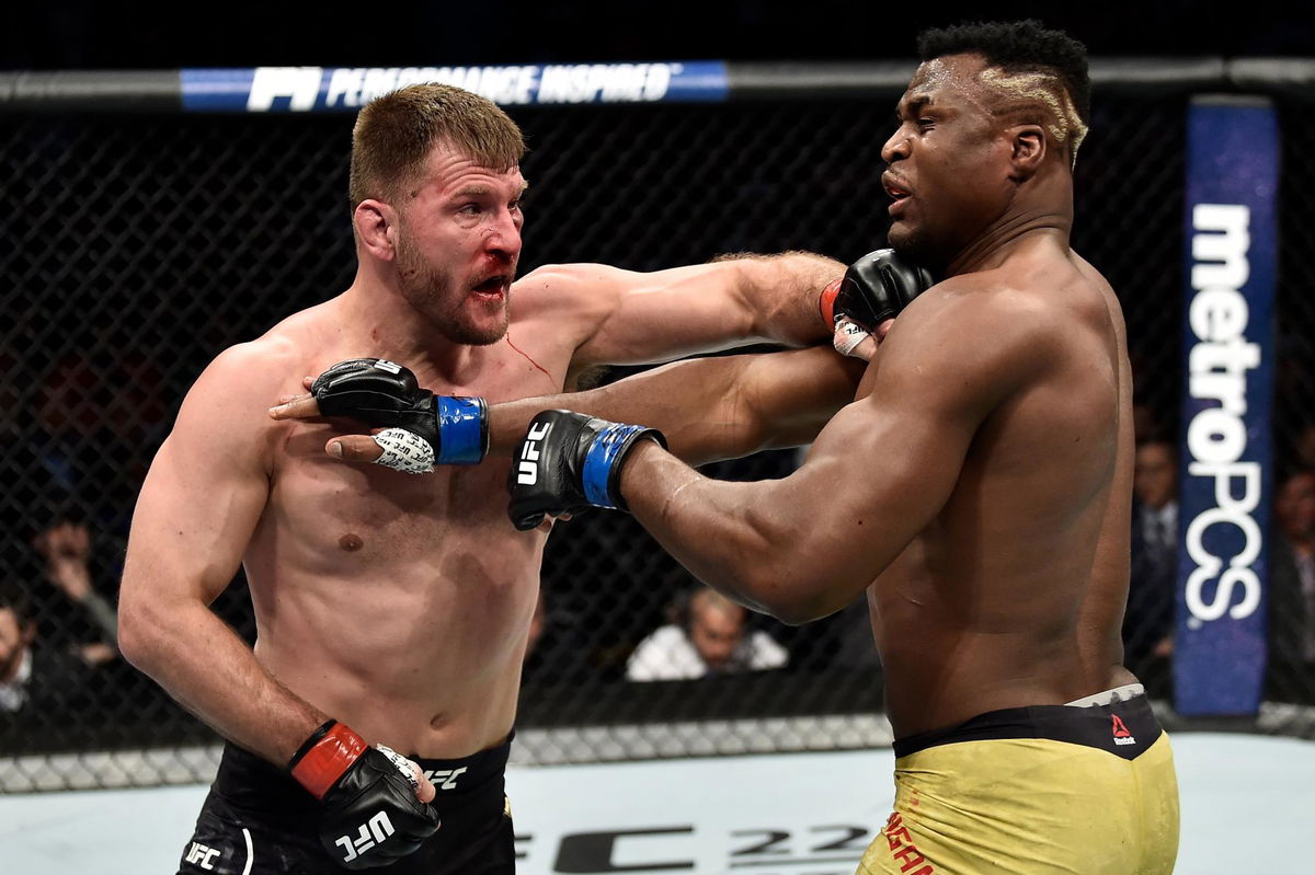 Image result for Stipe Miocic arm raised Francis Ngannou