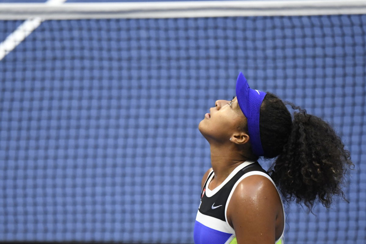 Naomi Osaka looks up to the sky after her victory against Victoria Azarenka at the 2020 US Open finals