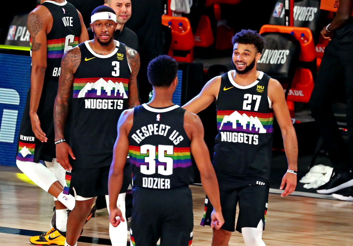 Denver Nuggets guard Jamal Murray celebrating with his team