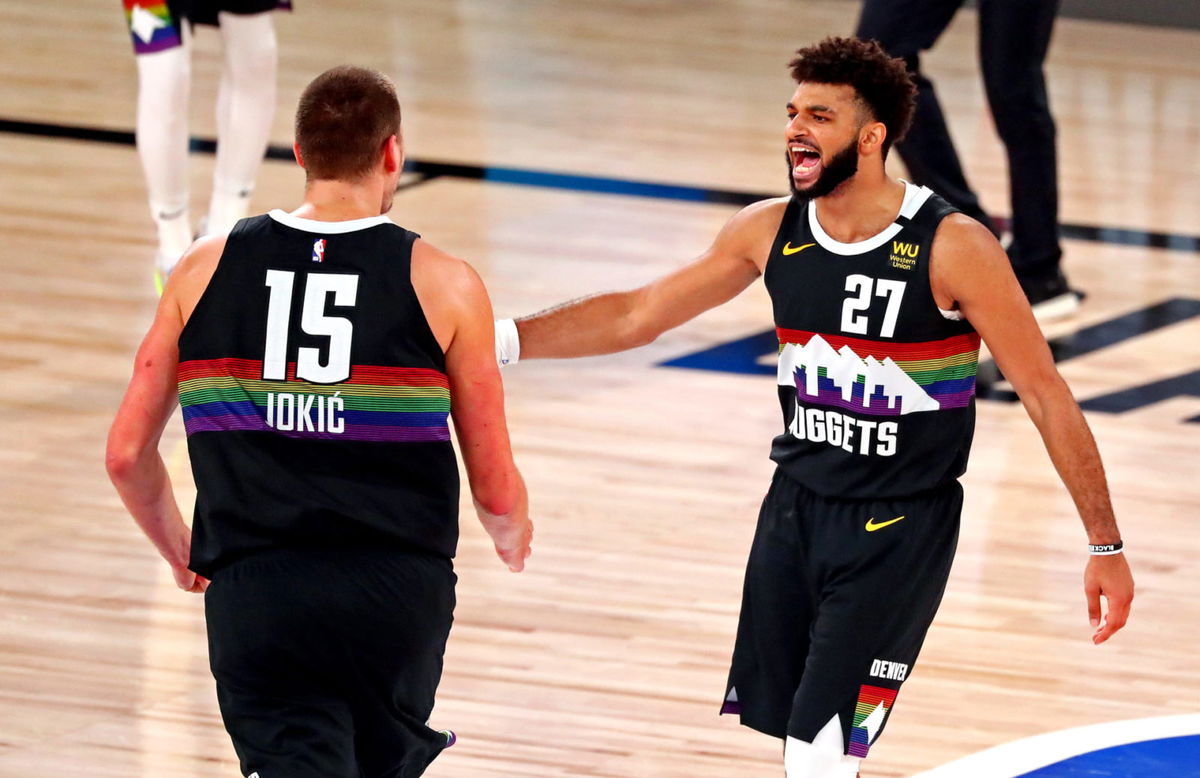 Nikola Jokic and Jamal Murray celebrating Denver Nuggets victory over LA Clippers
