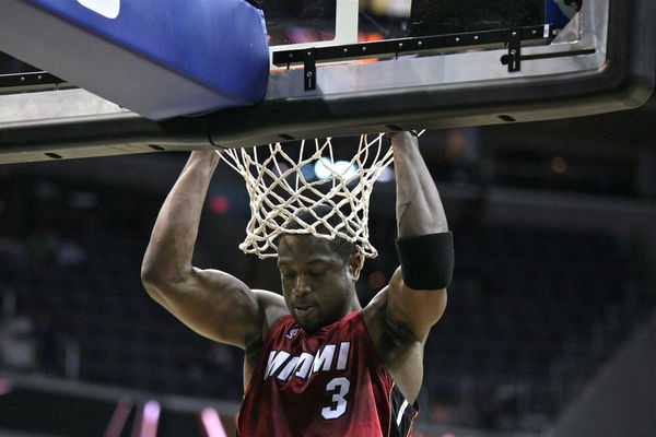 Dwyane_Wade_hanging_on_the_rim