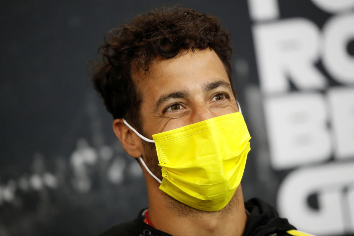Renault driver Daniel Ricciardo is all smiles at a press conference