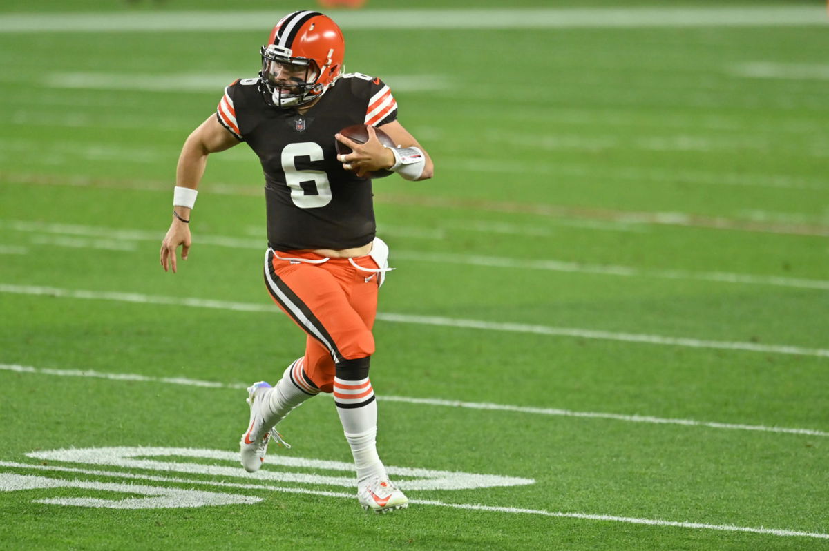 Cleveland Browns quarterback Baker Mayfield runs to complete a first down against Cincinnati Bengals