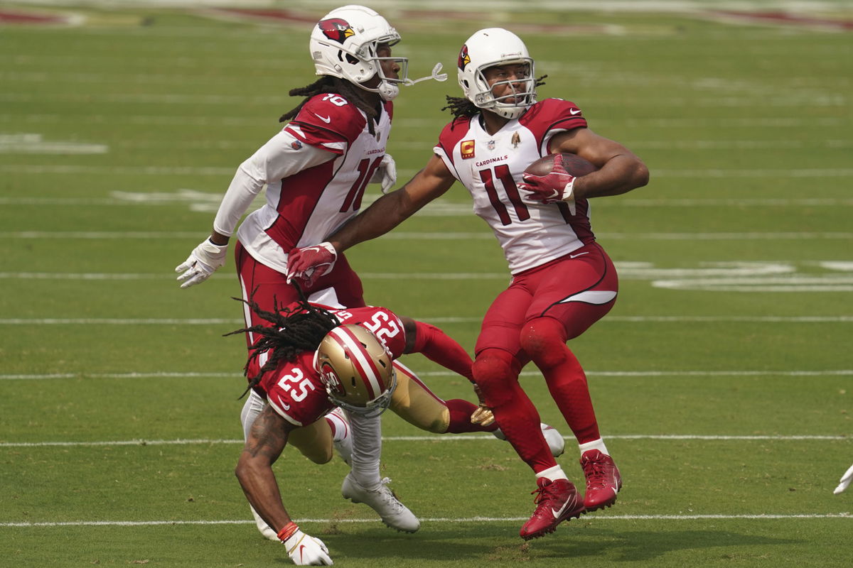 Arizona Cardinals wide receiver Larry Fitzgerald (11) runs in front of wide receiver DeAndre Hopkins.