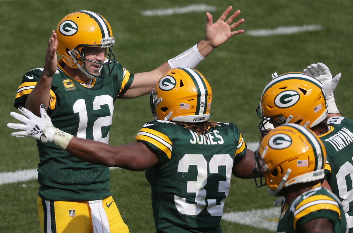 Green Bay Packers players, Aaron Rodgers and Aaron Jones, celebrate against the Detroit Lions on Sunday.