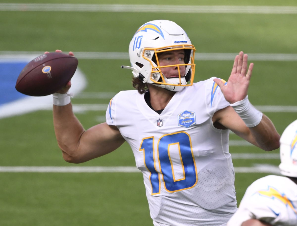 Los Angeles Chargers quarterback Justin Herbert throws a touchdown pass to wide receiver Jalen Guyton on Sunday.