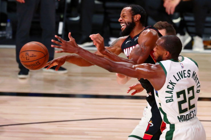 Milwaukee Bucks forward Khris Middleton and Miami Heat's Andre Iguodala