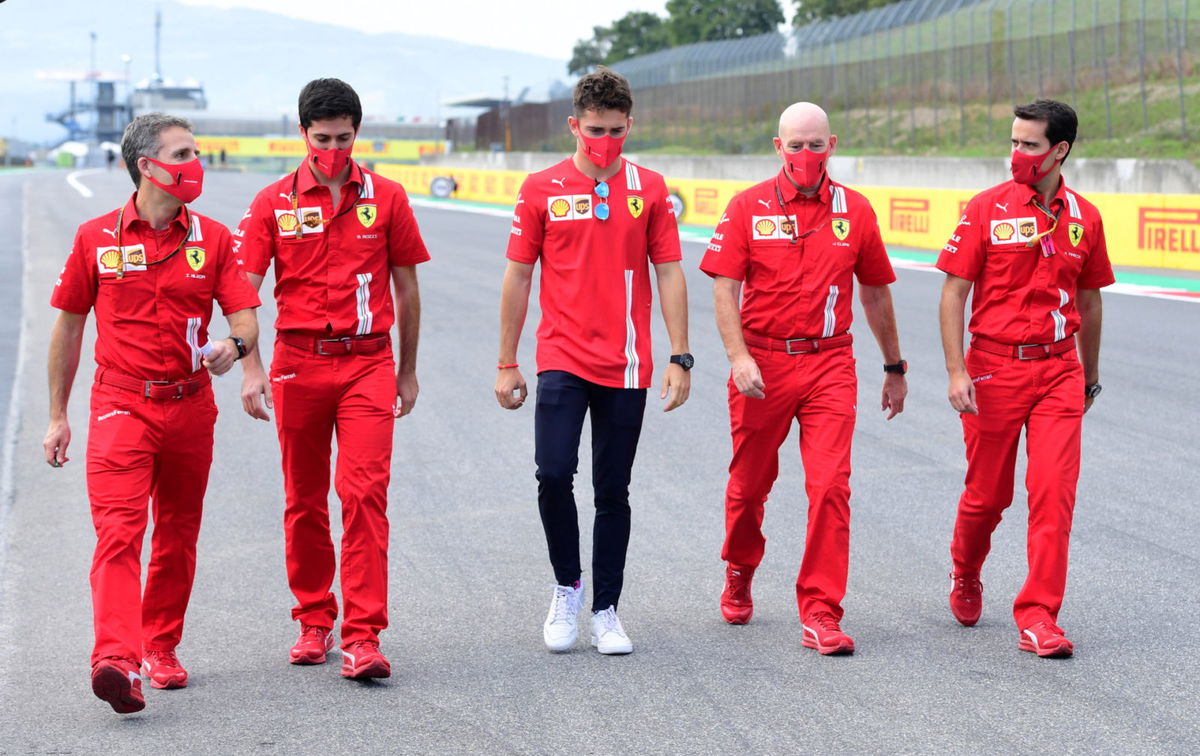 Charles Leclerc in discussions with his team