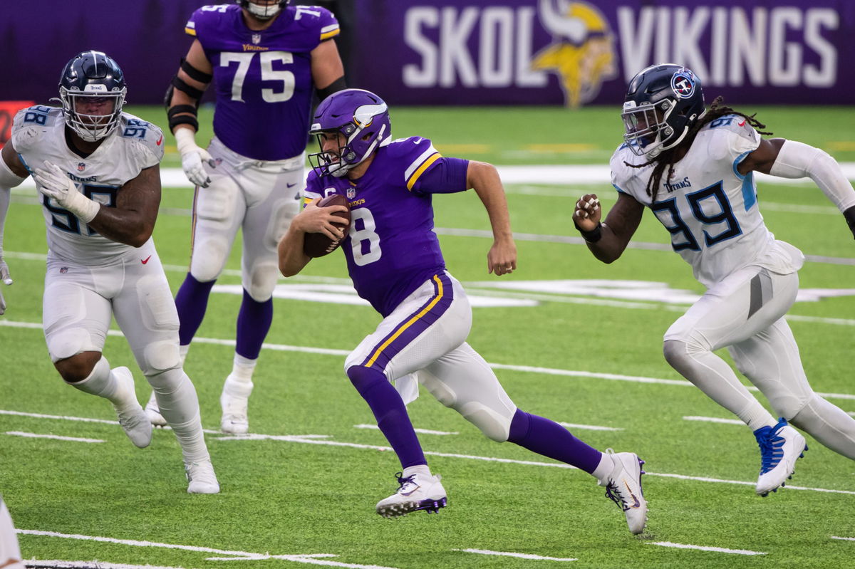 Minnesota Vikings quarterback Kirk Cousins makes a play against Tennessee Titans in Week Three.