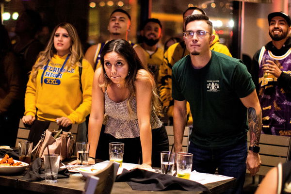 Los Angels Lakers fans react after Los Angeles Lakers lost to Miami Heat in the game 5 of the 2020 NBA Finals amid the coronavirus disease (COVID-19) outbreak, at an outdoor restaurant in Los Angeles