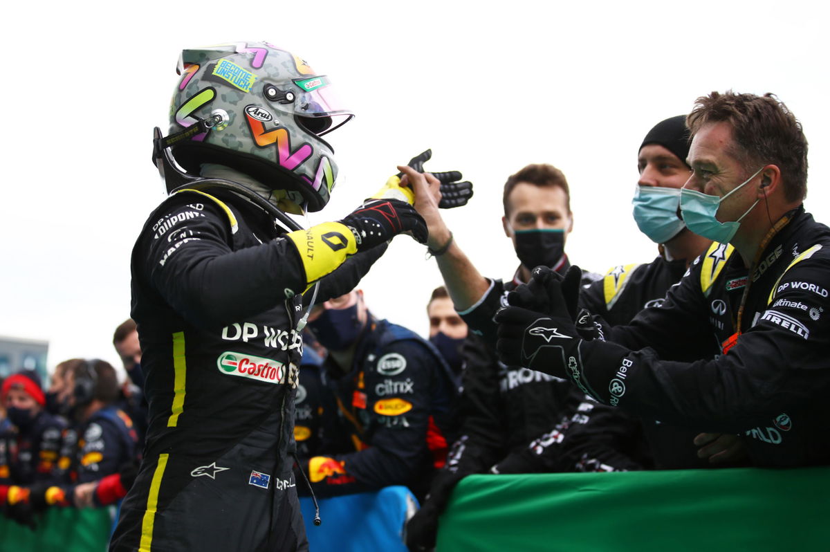 Daniel Ricciardo celebrates his podium finish with his Renault team