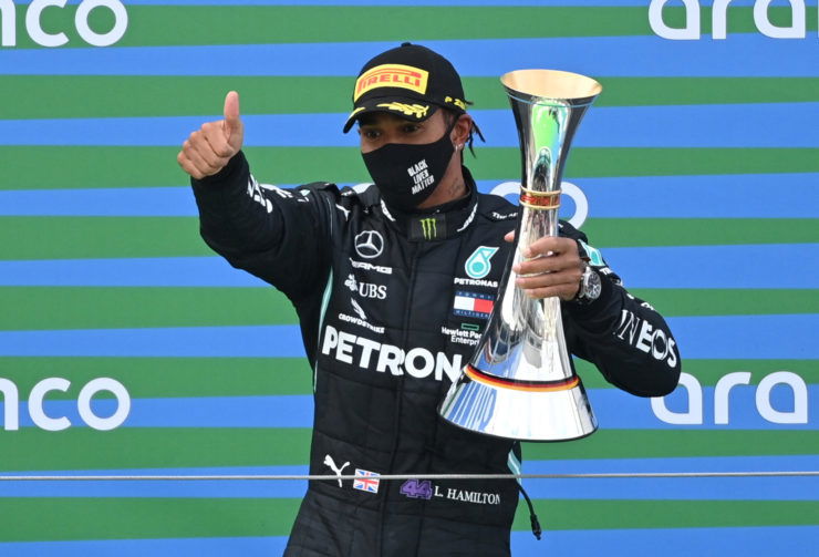 Mercedes driver Lewis Hamilton celebrates winning the Eifel GP