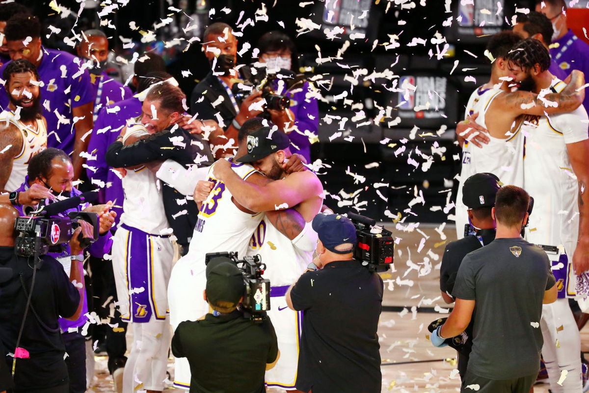 LA Lakers teammates Jared Dudley and LeBron James hug each other during the trophy presentation